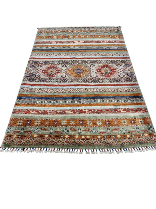 A beautifully designed Kazak Extra rug showcasing vibrant tribal motifs, perfect for elevating home decor.