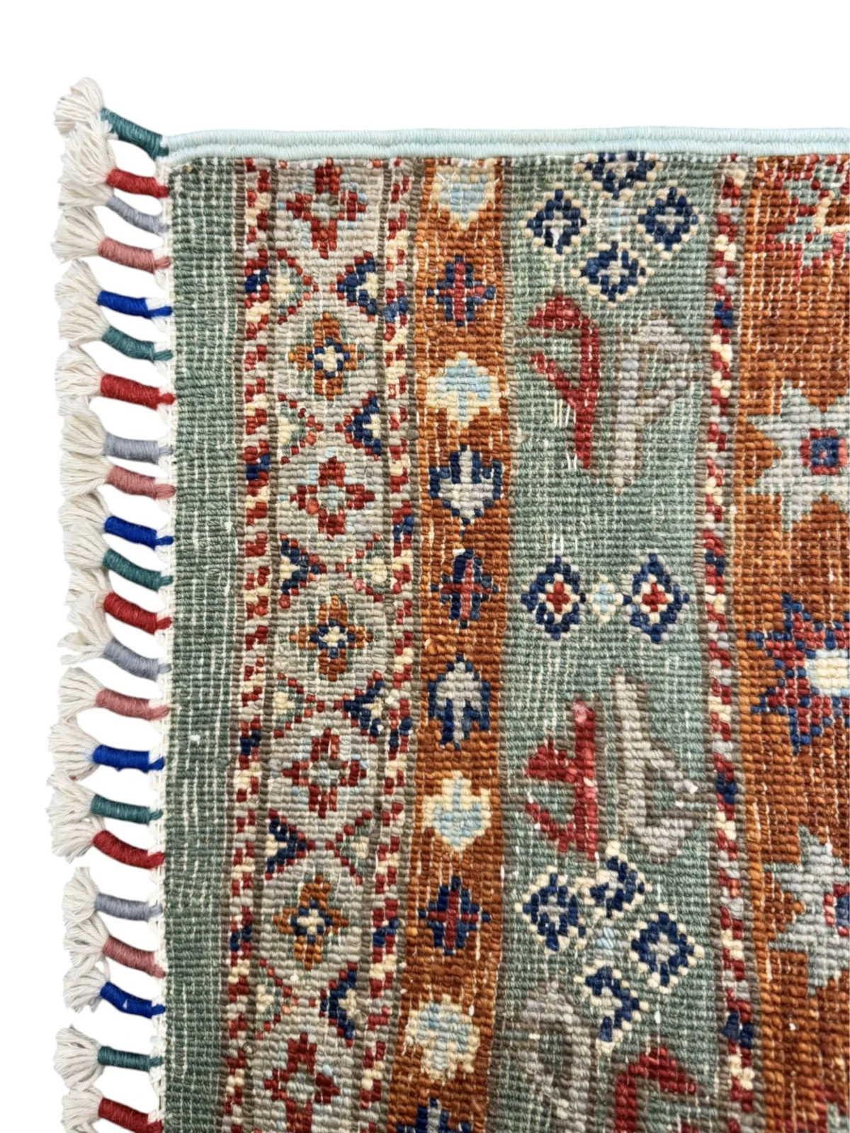 A colorful Kazak Extra rug displaying tribal patterns, adding a lively and decorative touch to the room's ambiance.