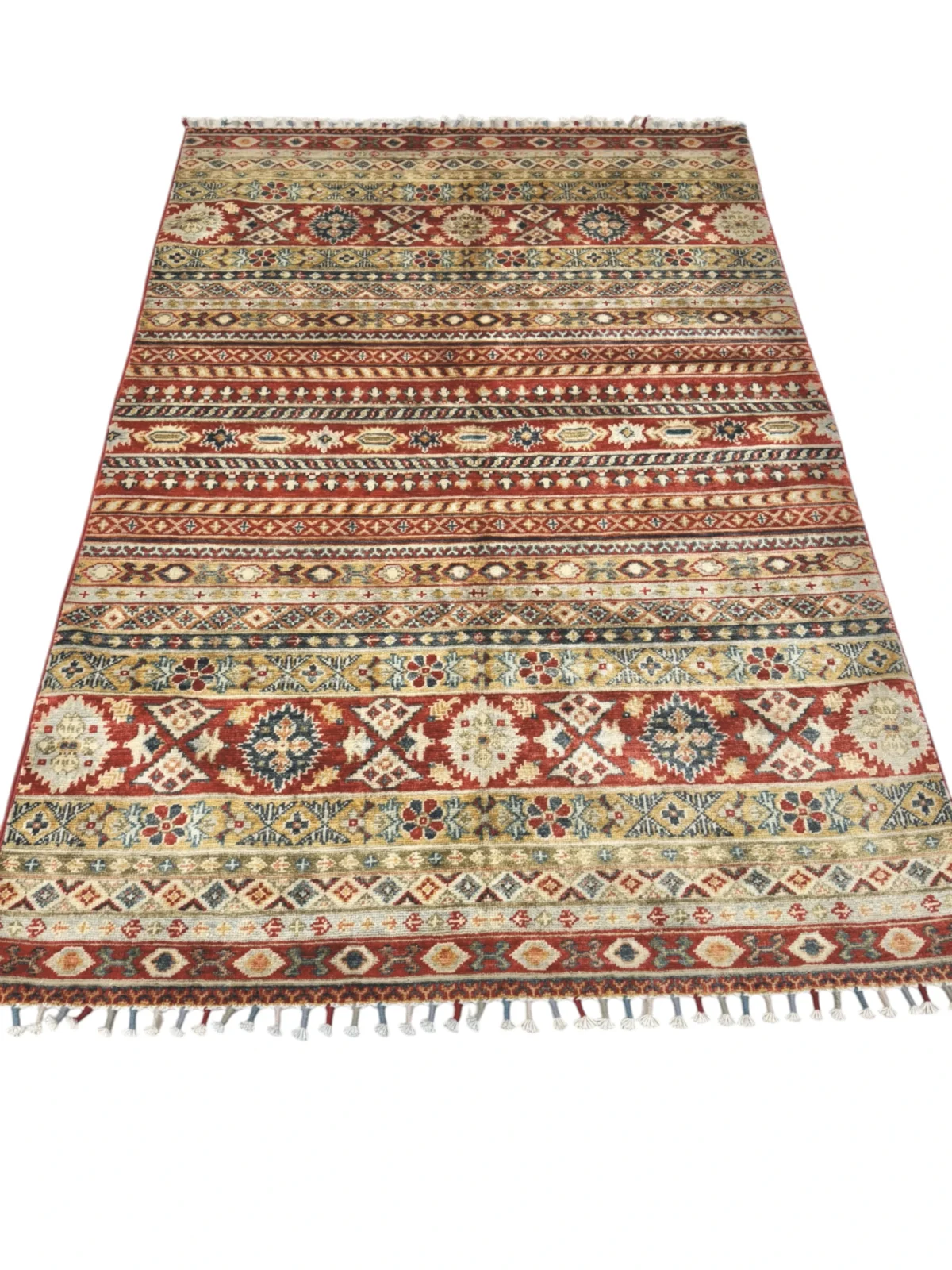 A beautiful Kazak rug with bold red, blue, and green tones, highlighting the artistry and beauty of traditional craftsmanship.