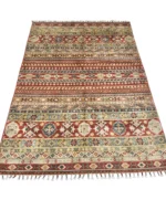 A beautiful Kazak rug with bold red, blue, and green tones, highlighting the artistry and beauty of traditional craftsmanship.