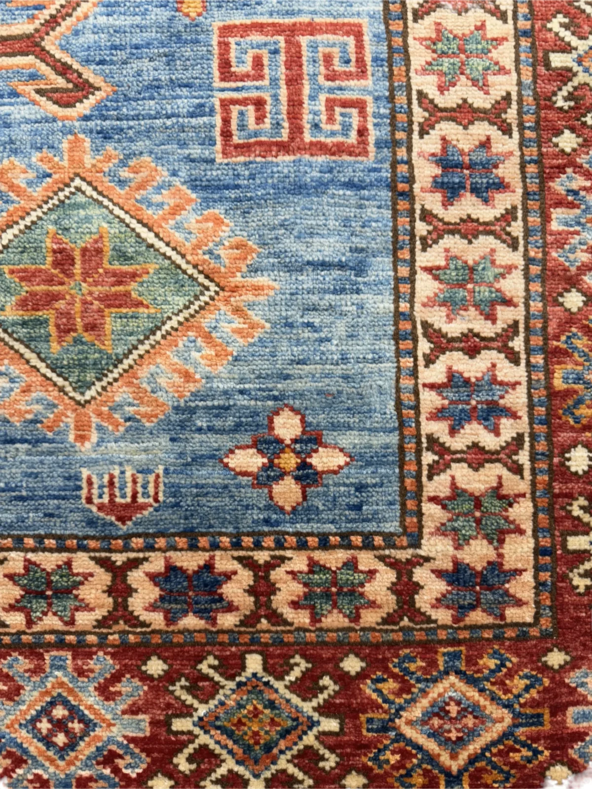 Stylish Afghan Kazak rug, 202x147 cm, showcasing elaborate patterns and vibrant hues, ideal for enhancing any room.