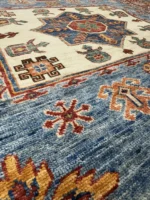 Elegant Afghan Kazak carpet measuring 202x147 cm with intricate designs and rich colors, perfect for refined interiors.