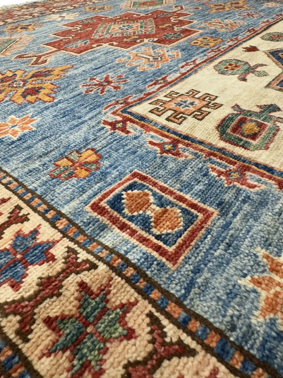 Stylish Afghan Kazak rug, 202x147 cm, adorned with elaborate patterns and vibrant hues, perfect for any decor.