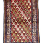 Scopri il tappeto Shirvan caucasico, 173x115 cm, un pezzo unico che unisce artigianato, storia e colori vibranti.
